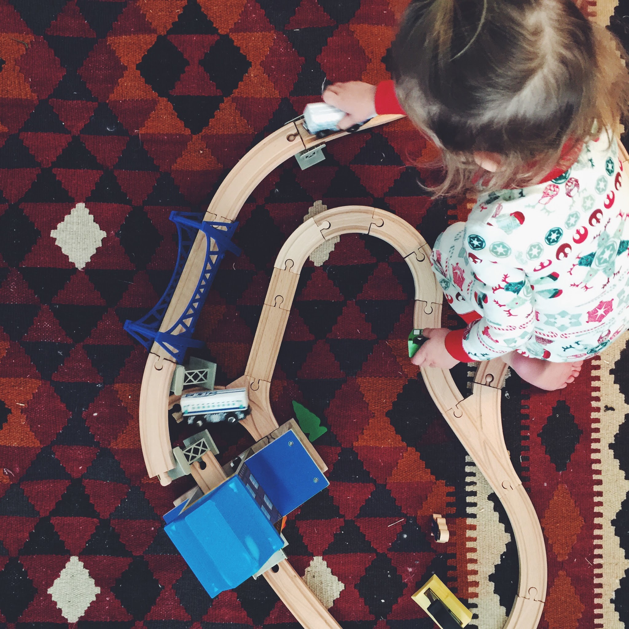Evelyn playing with her train set